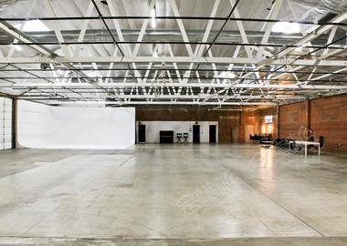 Modern Warehouse Event Studio featuring Exposed Brick & Private Suites
